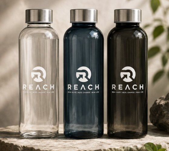 REACH branded glass water bottle
